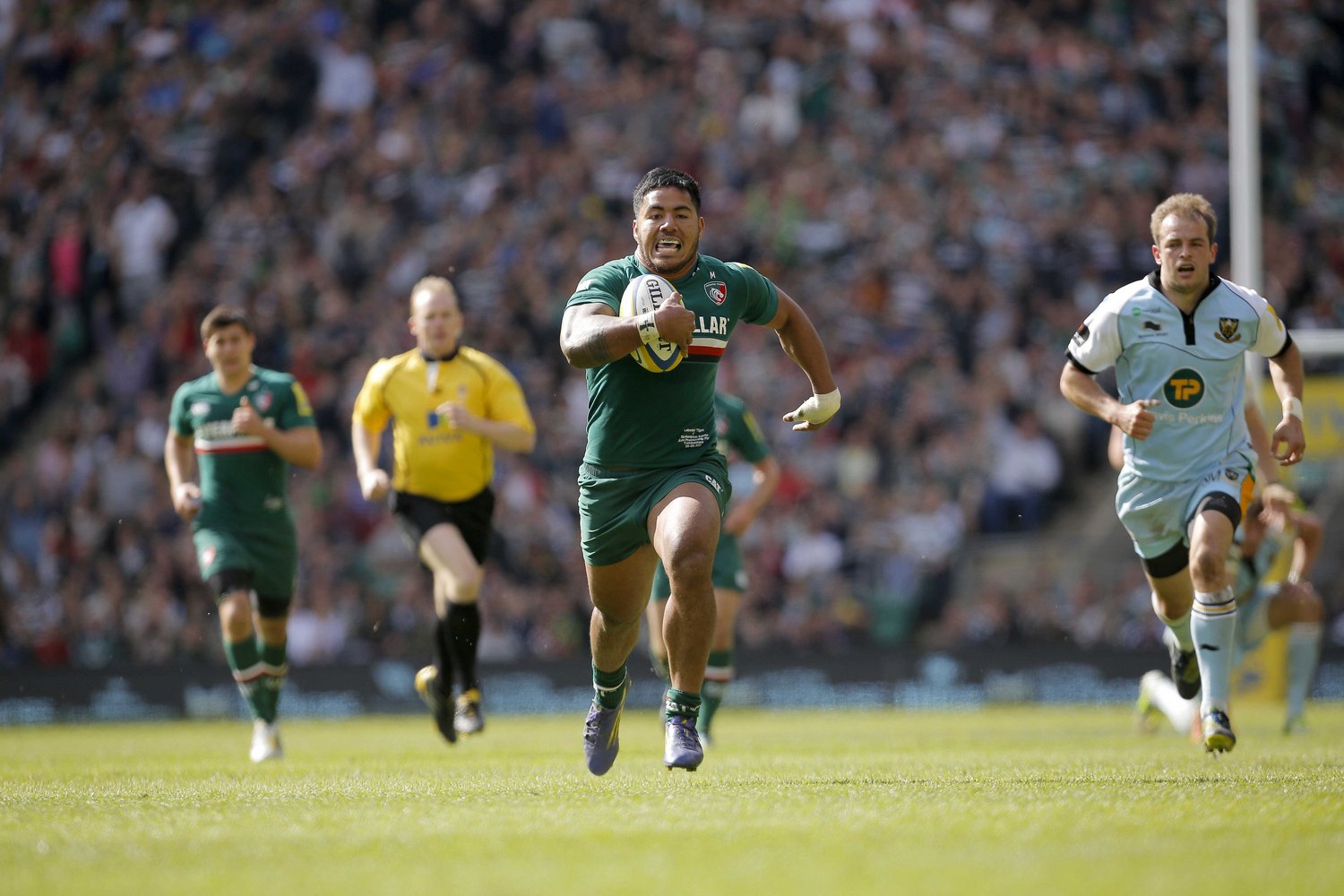 Manu Tuilagi runs in at Twickenham against the local rivals as Tigers are crowned champions