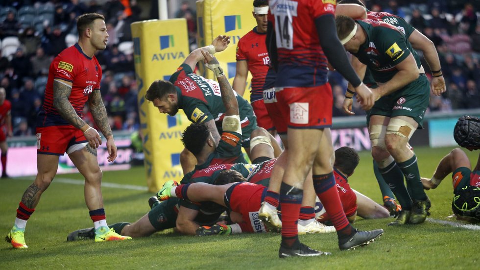 Sam Harrison is at the bottom of a pile of bodies as he grabs a try for Tigers