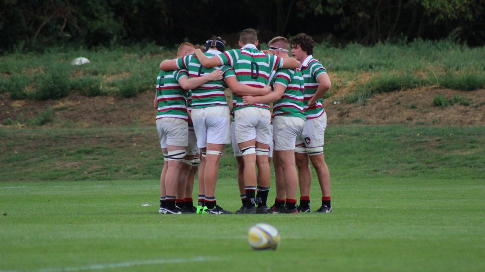 The Tigers Academy forward pack talk tactics during a break in play in their game against Bristol at Oval Park