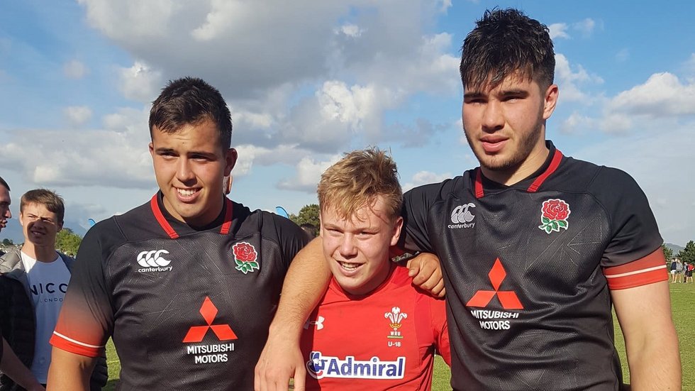 Sam Costelow with James Whitcombe (l) and George Martin (r) after the U18s game between Wales and England